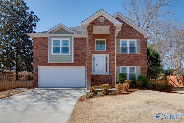 view of front of house featuring brick siding, fence, driveway, and an attached garage