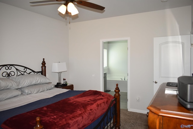 bedroom with ensuite bathroom and carpet