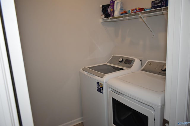 laundry area with laundry area and separate washer and dryer