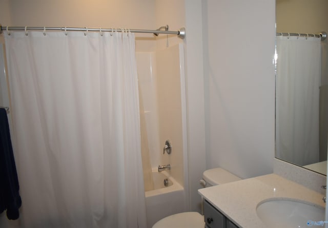 bathroom with toilet, vanity, and shower / bathtub combination with curtain