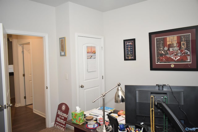 home office featuring baseboards and wood finished floors