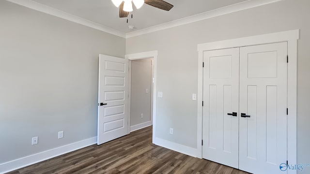 15685 Huntsville Brownsferry Rd, Athens, AL 35611 - unfurnished bedroom featuring a closet, a ceiling fan, baseboards, ornamental molding, and dark wood finished floors