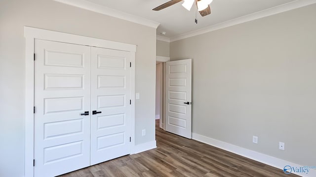15685 Huntsville Brownsferry Rd, Athens, AL 35611 - unfurnished bedroom with baseboards, a closet, ornamental molding, wood finished floors, and a ceiling fan