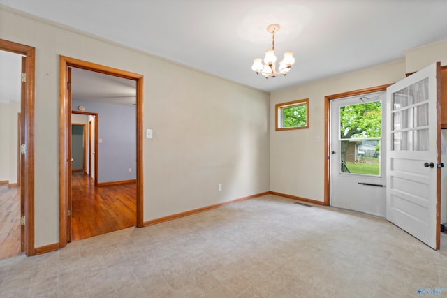 113 Gordon Dr, Athens, AL 35611 - spare room featuring a chandelier and baseboards