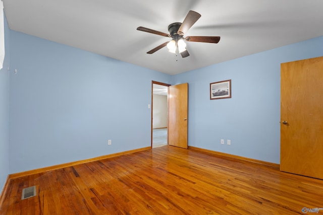 113 Gordon Dr, Athens, AL 35611 - unfurnished bedroom with wood finished floors, baseboards, and ceiling fan