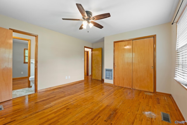 113 Gordon Dr, Athens, AL 35611 - unfurnished bedroom featuring light wood finished floors, a closet, heating unit, and baseboards