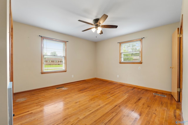 113 Gordon Dr, Athens, AL 35611 - spare room featuring light wood-style floors, ceiling fan, and baseboards