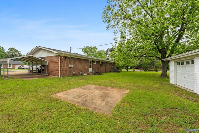 113 Gordon Dr, Athens, AL 35611 - view of green lawn with a garage and a carport