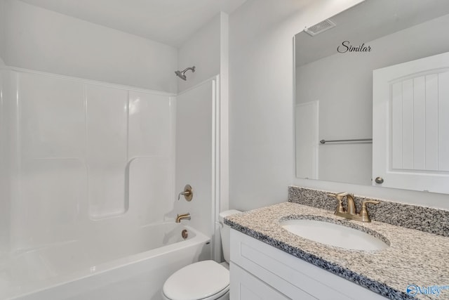 full bathroom with vanity, shower / tub combination, and toilet