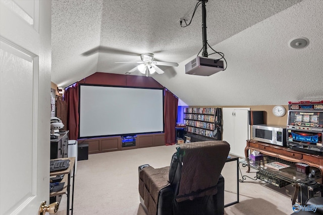 194 Bonaire Dr, Huntsville, AL 35811 - home theater room featuring a textured ceiling, carpet flooring, ceiling fan, and lofted ceiling