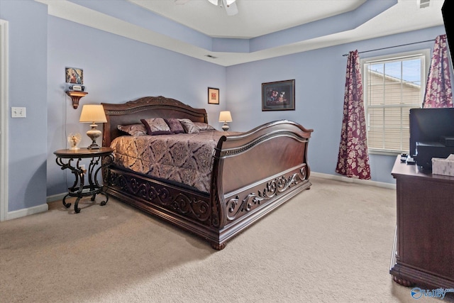 194 Bonaire Dr, Huntsville, AL 35811 - carpeted bedroom featuring baseboards, a raised ceiling, and ceiling fan