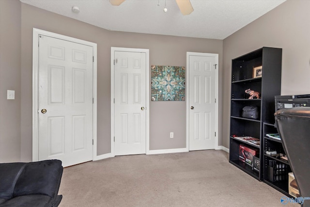 194 Bonaire Dr, Huntsville, AL 35811 - living area with ceiling fan, carpet flooring, and baseboards
