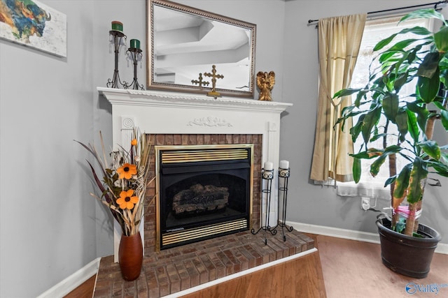 194 Bonaire Dr, Huntsville, AL 35811 - detailed view of a fireplace, wood finished floors, and baseboards