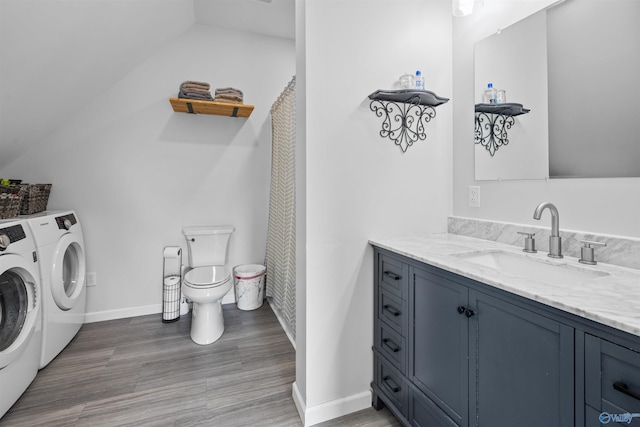 331 Ayers Cir, Grant, AL 35747 - full bathroom featuring independent washer and dryer, toilet, vaulted ceiling, vanity, and wood finished floors