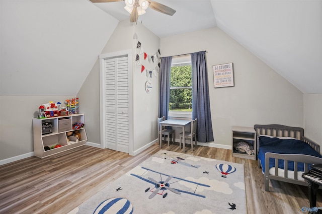 331 Ayers Cir, Grant, AL 35747 - bedroom with lofted ceiling, wood finished floors, a closet, and baseboards