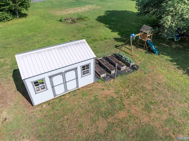 331 Ayers Cir, Grant, AL 35747 - view of grassy yard featuring a playground and a garden