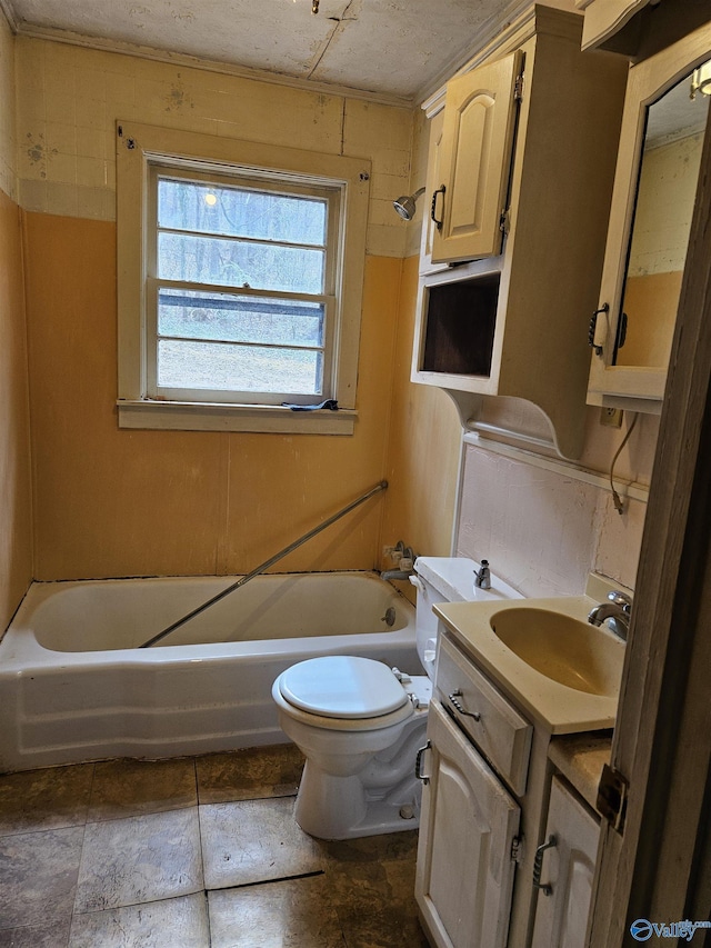 bathroom featuring toilet, shower / washtub combination, and vanity