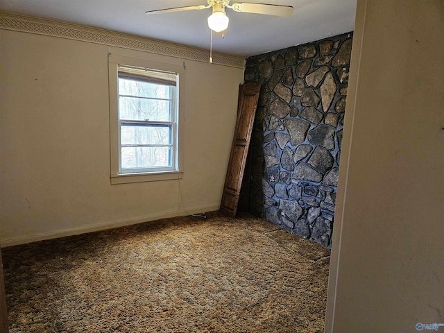 empty room featuring carpet flooring, ceiling fan, and baseboards