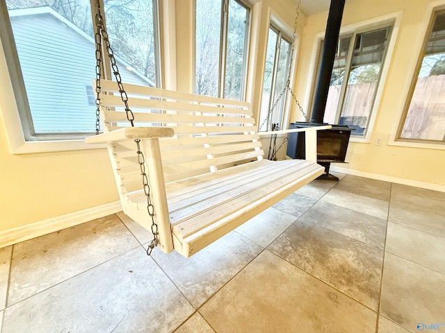 stairway featuring a wood stove