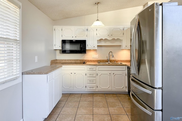 kitchen with black appliances, white cabinets, lofted ceiling, and sink