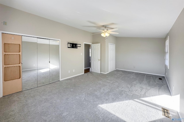 unfurnished bedroom with carpet flooring and ceiling fan