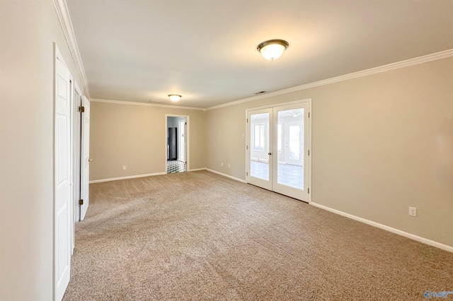 spare room with carpet, french doors, and ornamental molding