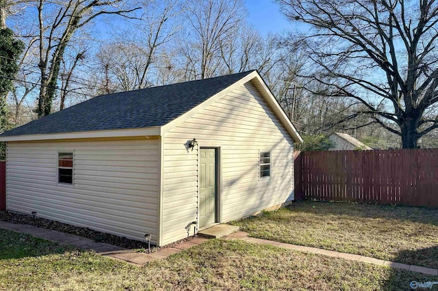 view of outbuilding featuring a lawn