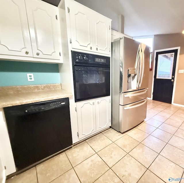 kitchen featuring white cabinets, black appliances, and light tile patterned floors