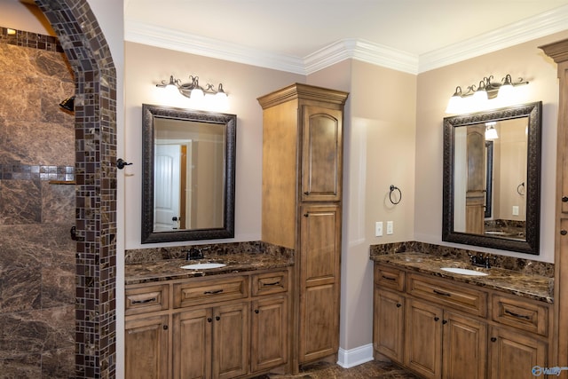 bathroom with crown molding and vanity