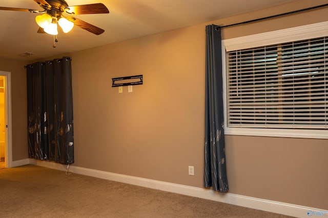 carpeted empty room with ceiling fan