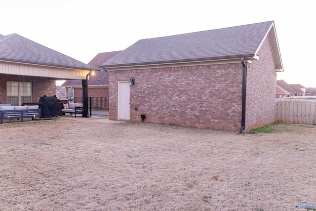 back of house with a patio area and an outdoor hangout area