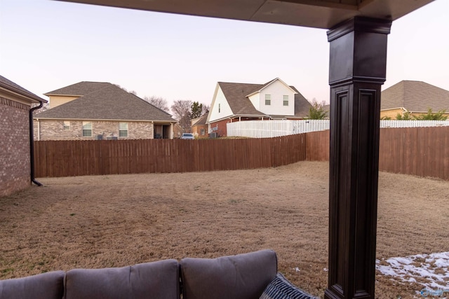 view of yard at dusk