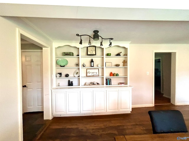 interior space with built in features, dark hardwood / wood-style floors, and white cabinets