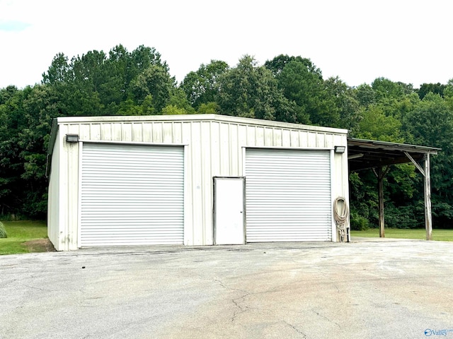 garage featuring a carport