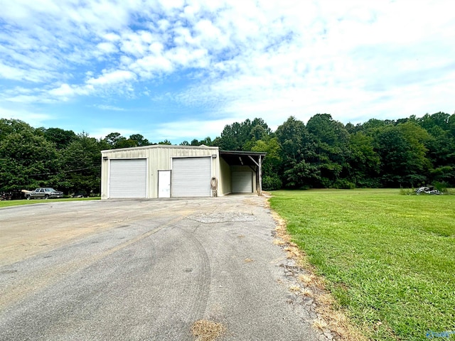 garage featuring a yard