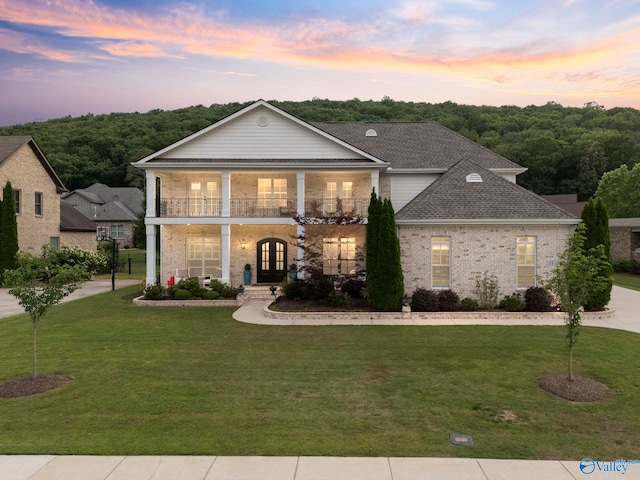 11 SE Braewick Pl, Gurley, AL 35748 - neoclassical / greek revival house featuring french doors, a balcony, a front lawn, and brick siding