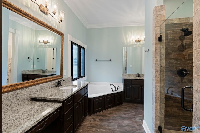 11 SE Braewick Pl, Gurley, AL 35748 - bathroom with a shower stall, two vanities, a garden tub, crown molding, and wood finished floors
