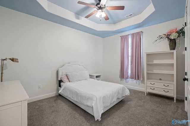 11 SE Braewick Pl, Gurley, AL 35748 - bedroom with a raised ceiling, baseboards, ceiling fan, and dark carpet