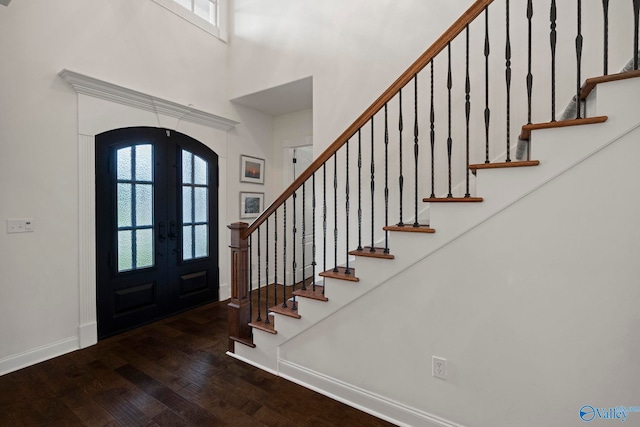 11 SE Braewick Pl, Gurley, AL 35748 - foyer entrance with arched walkways, wood-type flooring, baseboards, healthy amount of natural light, and a high ceiling