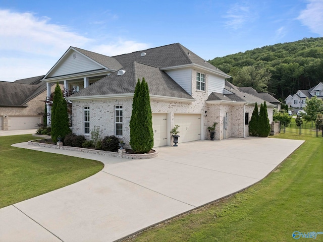 11 SE Braewick Pl, Gurley, AL 35748 - view of front of house featuring driveway, a shingled roof, and brick siding