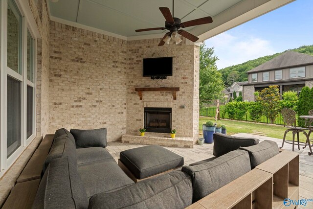 11 SE Braewick Pl, Gurley, AL 35748 - view of patio / terrace with an outdoor living space with a fireplace and ceiling fan