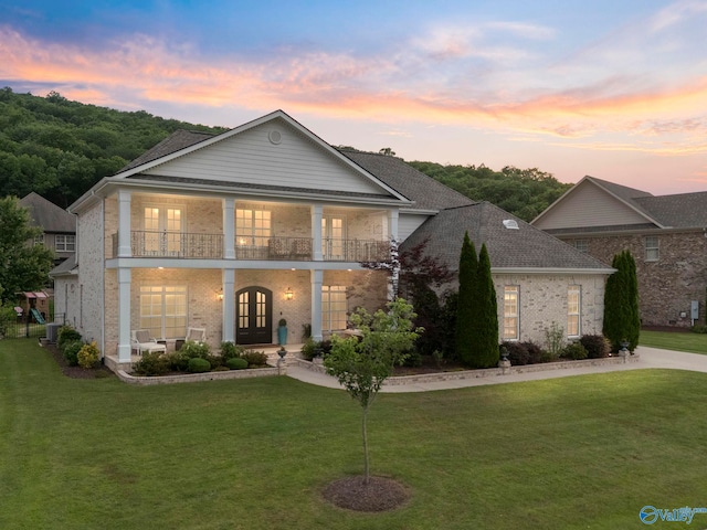 11 SE Braewick Pl, Gurley, AL 35748 - neoclassical home featuring french doors, brick siding, a lawn, and a balcony
