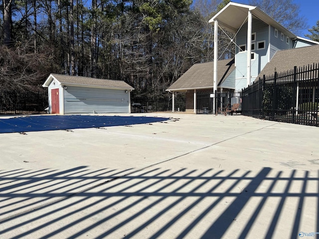 exterior space with an outbuilding and a garage