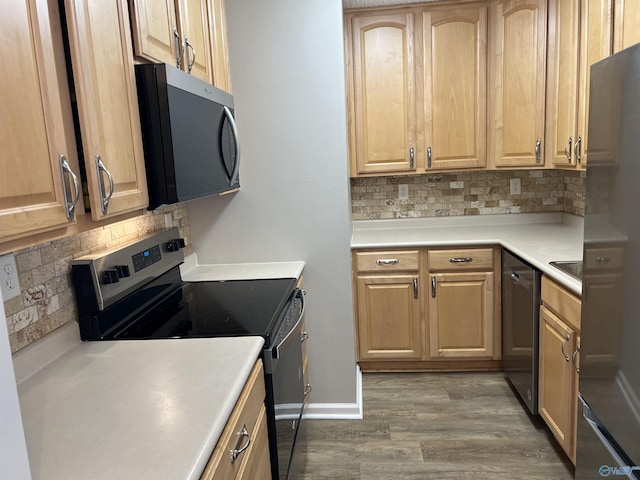 kitchen with decorative backsplash, dark hardwood / wood-style floors, light brown cabinetry, and appliances with stainless steel finishes