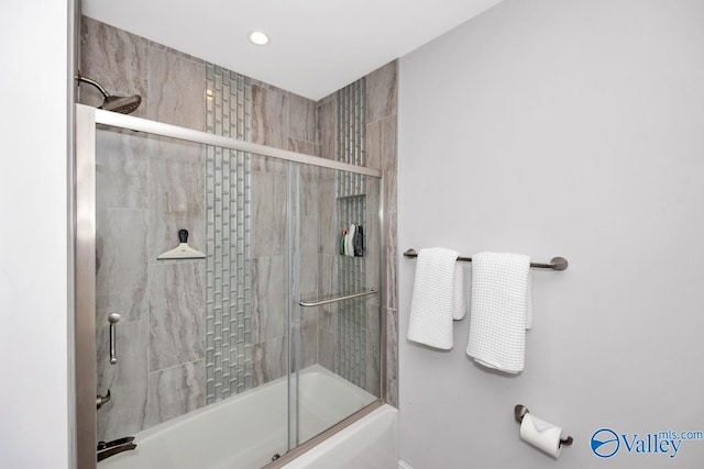 bathroom with bath / shower combo with glass door and recessed lighting