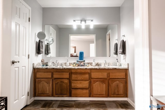 full bath featuring a sink and double vanity