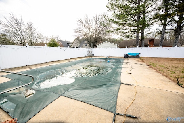 view of pool with a fenced backyard, a patio area, and a fenced in pool