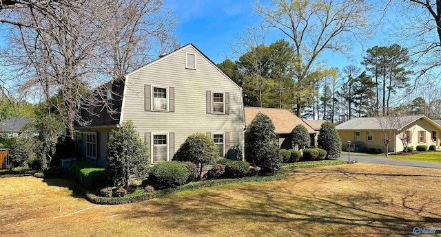 view of side of property with a yard