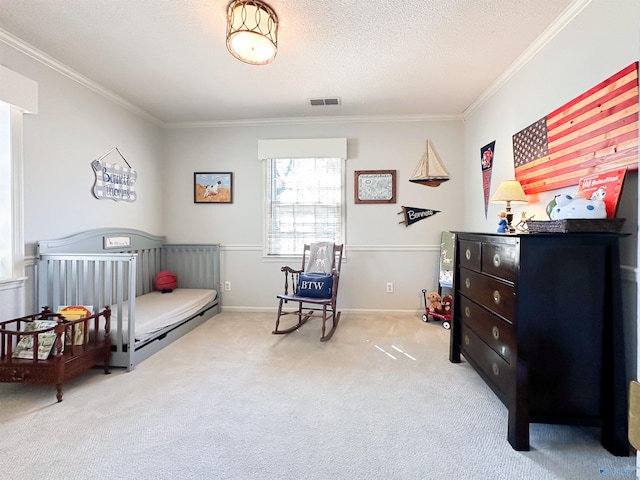carpeted bedroom featuring baseboards, visible vents, crown molding, and a textured ceiling