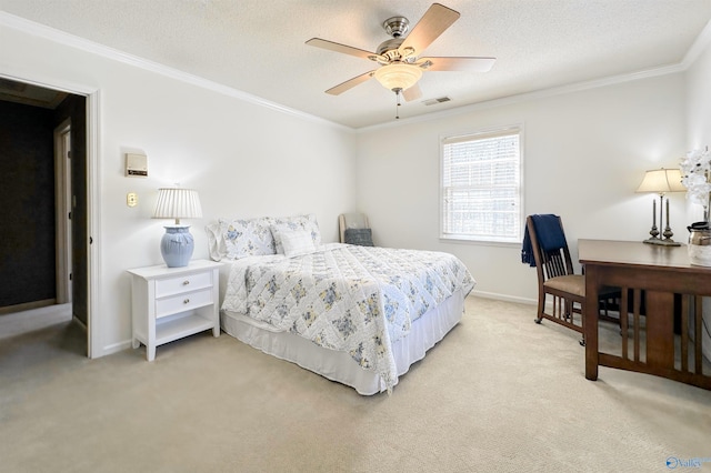 bedroom with crown molding, baseboards, a textured ceiling, visible vents, and light carpet